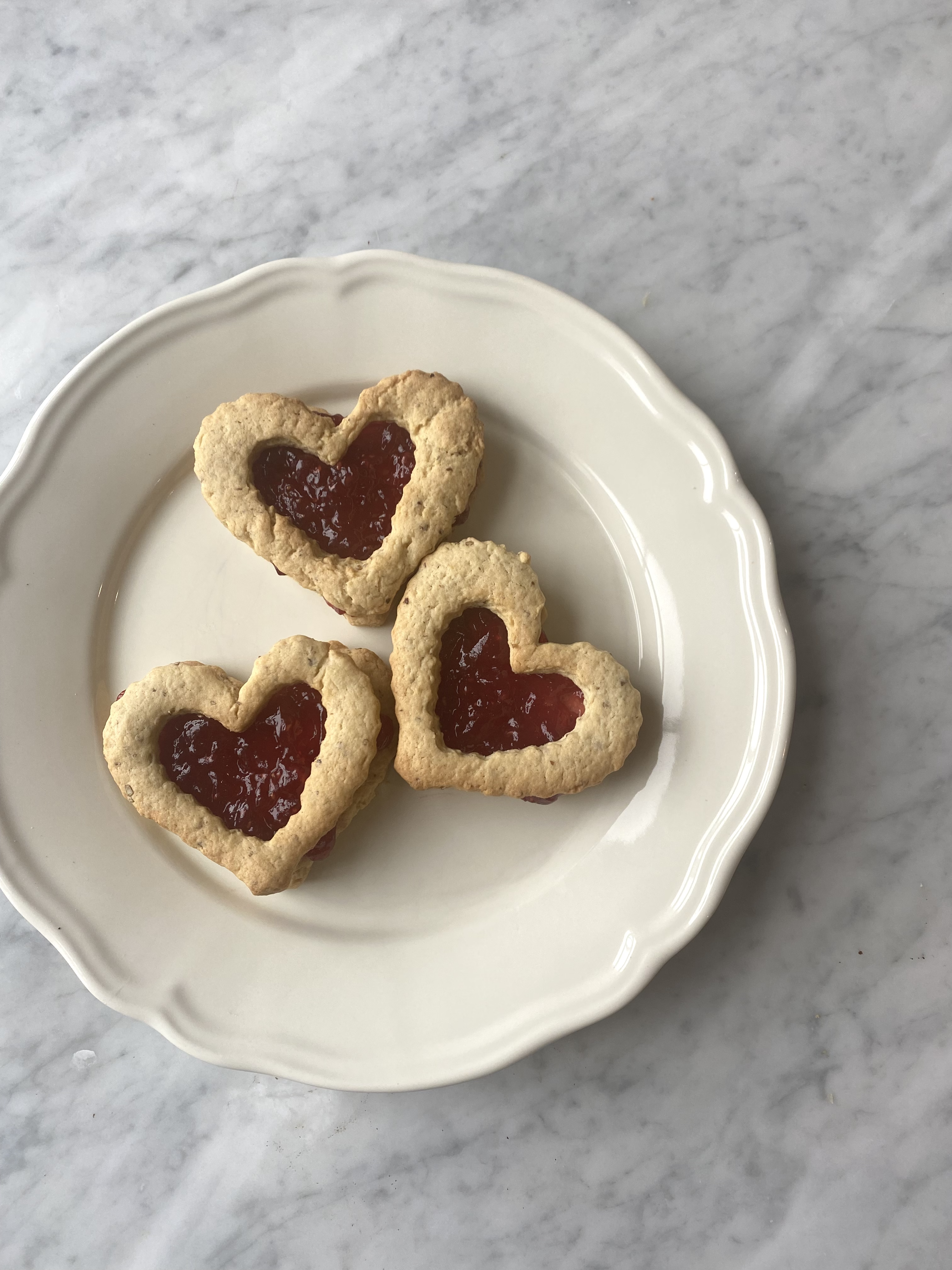 vegan + gluten free valentine’s cookies (raspberry linzer cookies)